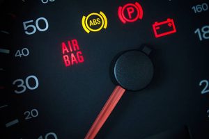 Airbag warning light. Car dashboard in closeup